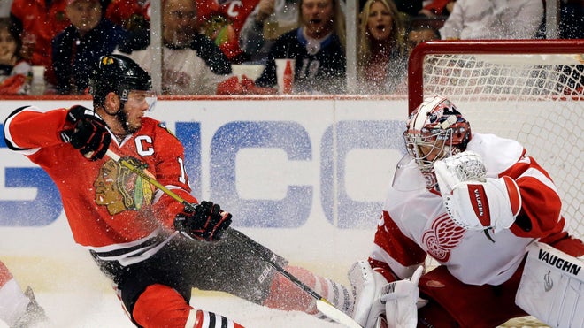  Jonathan Toews and Andrew Shaw scored power-play goals in the second period, and the Chicago Blackhawks avoided elimination with a - victory over the Detroit Red Wings on Saturday night in Game  of the second-round playoff series.